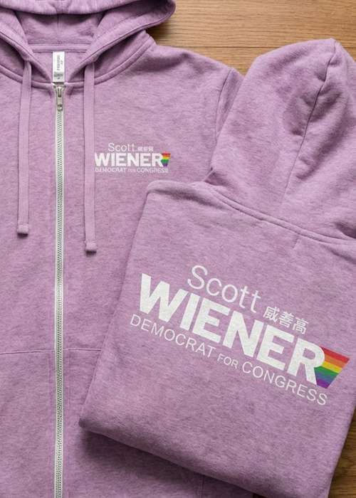Purple hoodie with 'Scott Wiener Democrat for Congress' text on a wooden surface